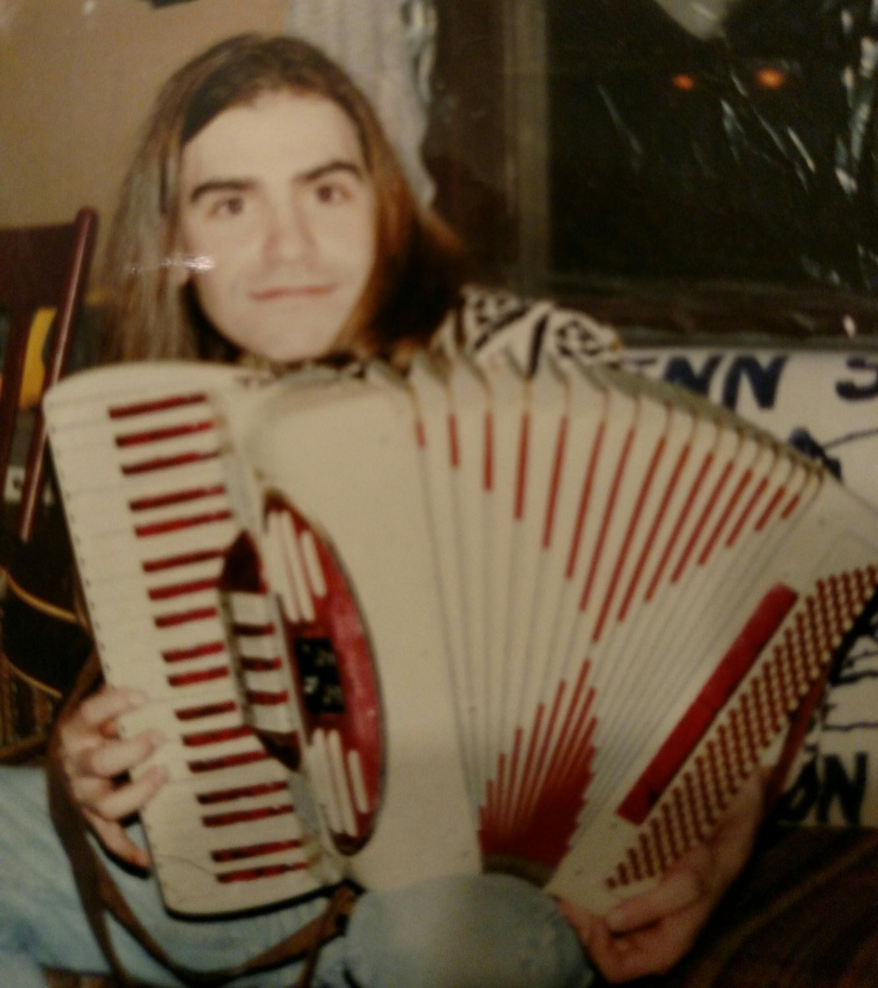 A young Matt Williams playing accordion