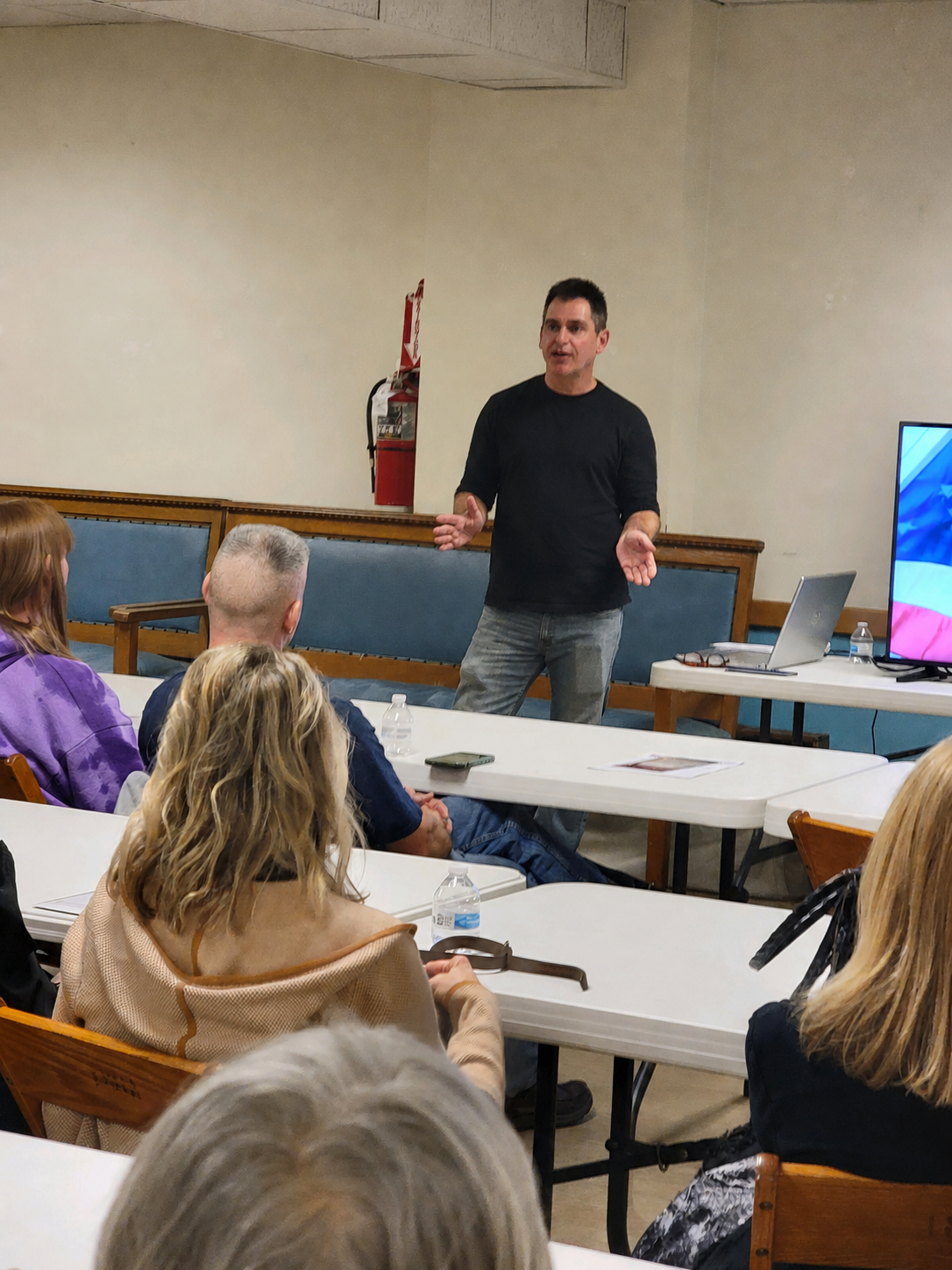 Matt Williams speaking with a community group